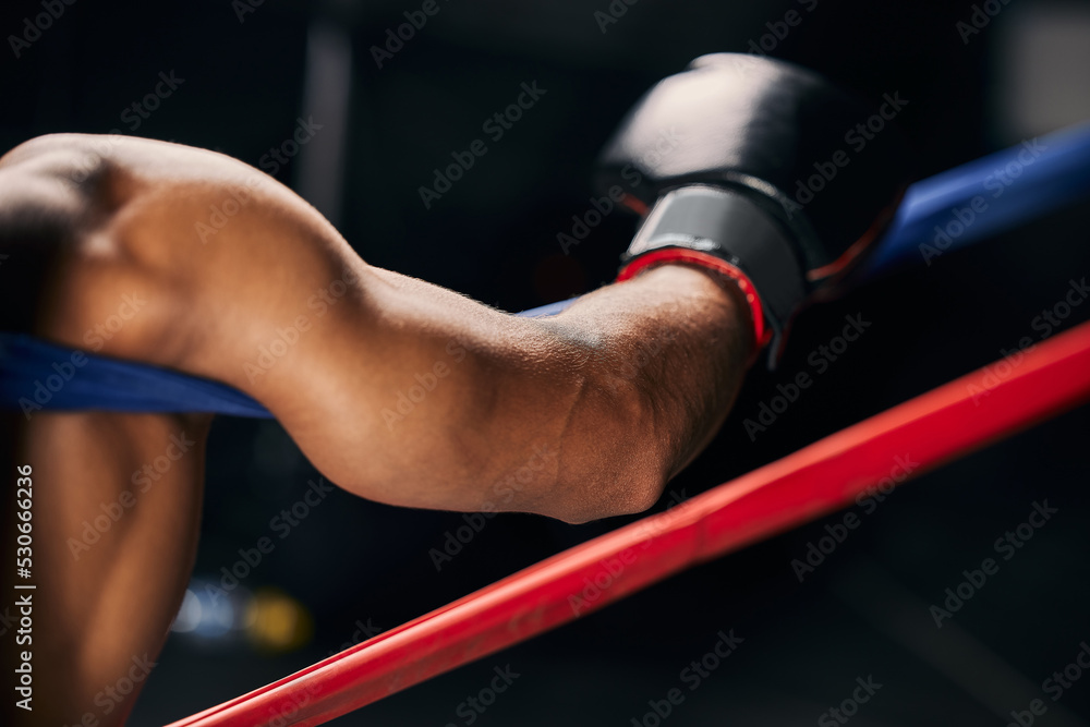 Wall mural sports, fight and hand of a boxing man resting in the corner of a boxing ring during an exhibition m