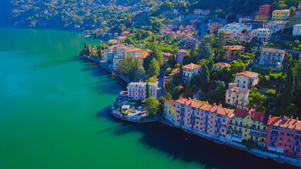 Aerial view of Lake Como. city ​​center. A local ferry arrives in the city. Bell tower. Tourism...