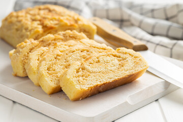 Sweet pie with nut flavor on cutting board.
