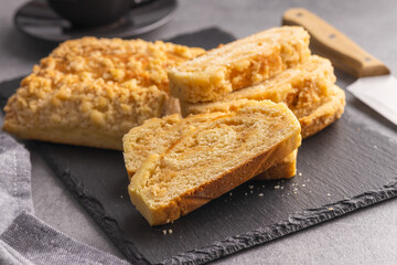 Sweet pie with nut flavor on cutting board.