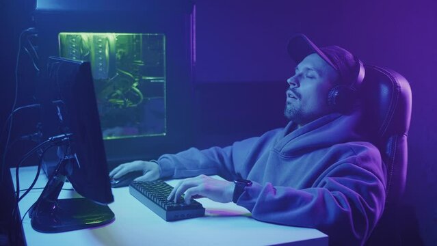 sleeping gamer at a computer in a chair