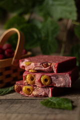 Photo of natural handmade homemade soap on raspberry puree