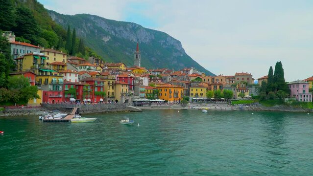 Aerial view of the colorful town on Lake Como. Vacation in italy in the alps. Tourism and romance on a sailboat. Mountains around the lake. Sunny day. Green Planet. Italy, Bellgio, 09.2022