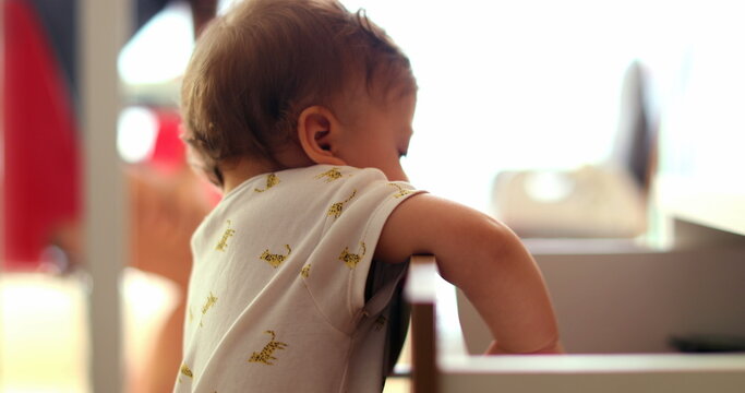 Baby Grabbing Something From Drawer