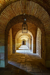 Brick arches in the passages of the castle of Montjuic in the city of Barcelona, Spain.