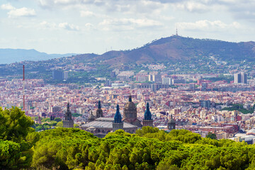 Panoramic view of the city of Barcelona with its buildings huddled next to the hills surrounding the city, Spain.
