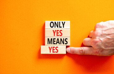 Only yes means yes symbol. Concept words Only yes means yes on wooden blocks on a beautiful orange table orange background. Businessman hand. Business, psychological only yes means yes concept.