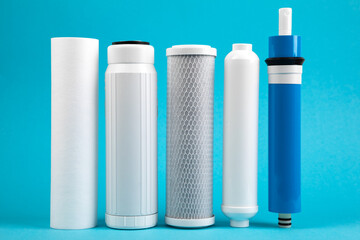 filter cartridges for water on a bright blue background.