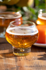 Food and drink pairing, apple cider produced on organic farm from bio apples in Normandy, France and cheddar cheese from England