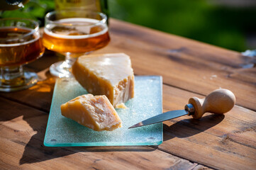 Cheese pairing with drinks,  parmigiano reggiano or parmesan cheese and French apple cider served...