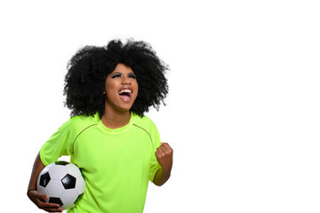 woman holding soccer ball, shouts celebrating with closed hand, big afro hair, flourishing green...