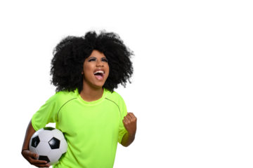 woman holding soccer ball, shouts celebrating with closed hand, big afro hair, flourishing green uniform