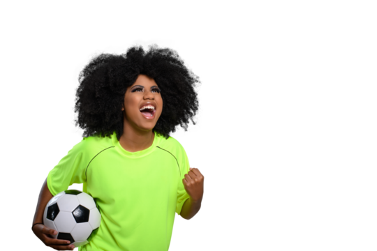woman holding soccer ball, shouts celebrating with closed hand, big afro hair, flourishing green uniform