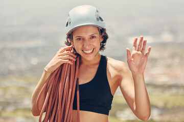 Rock climbing, rope and woman portrait happy to challenge her fitness and hiking outdoors in nature...