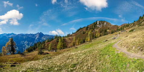 Peaceful autumn Alps mountain sunny view from hiking path from Dorfgastein to Paarseen lakes, Land Salzburg, Austria.