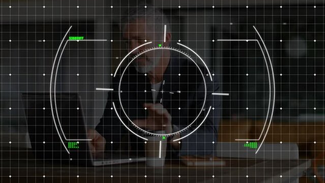 Animation of scope scanning and data over caucasian businessman using laptop