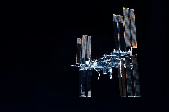 International space station over the planet. Elements of this image furnished by NASA - Powered by Adobe