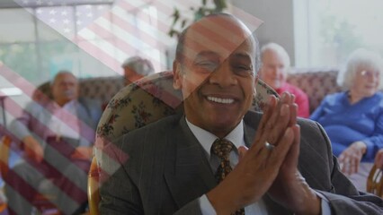 Animation of flag of usa over african american businessman and senior diverse people - Powered by Adobe