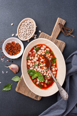 Bowl of vegetarian healthy meal with beans and tomato sauce