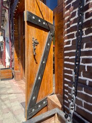ancient wooden door with a chains