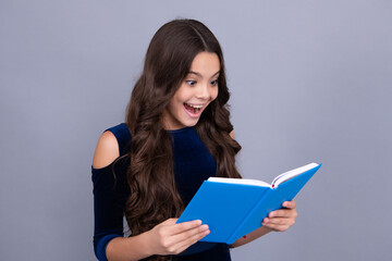 Fototapeta premium Back to school. Teenager schoolgirl hold book and copybook ready to learn. School children on isolated grey background. Excited teenager schoolgirl.