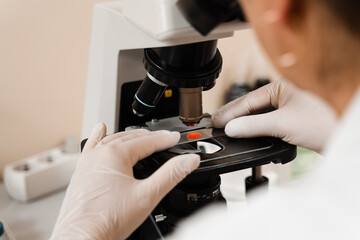 Blood analysis using microscope laboratory close-up. Medical equipment for hematological and...