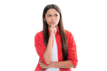 Thinking pensive clever teenager girl. Thoughtful teenage child girl on white isolated background. Portrait of a kid thinking over idea. Pensive girl.
