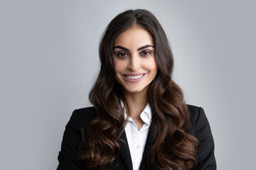 Fototapeta premium Female business model face. Happy smiling woman portrait. Attractive young pretty cheerful girl in casual clothing feeling happy and carefree, isolated background.