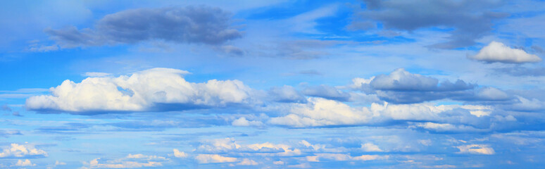 Blue sky landscape with white clouds. Horizontal banner with free copy space for text