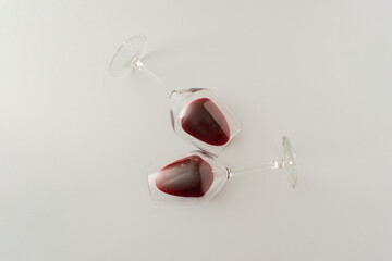 Wine glasses full of blood on gray background. Minimal Halloween blood drink concept.