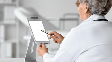 Elderly female doctor giving consultation online. Telemedicine concept