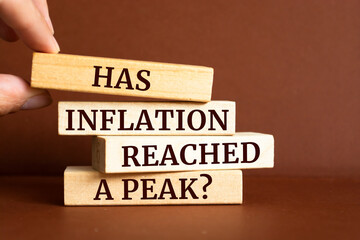 Obraz premium Wooden blocks with words 'Has inflation reached a peak?'.