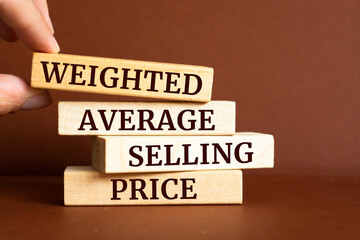 Wooden blocks with words 'Weighted Average Selling Price'. WASP