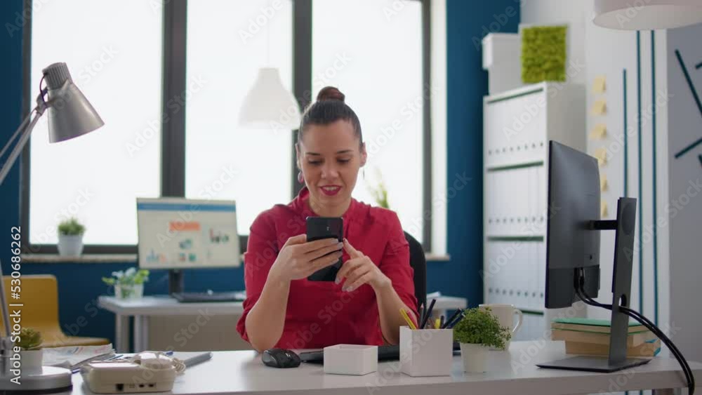 Poster sales assistant with marketing experience using smartphone to browse internet for project research. 