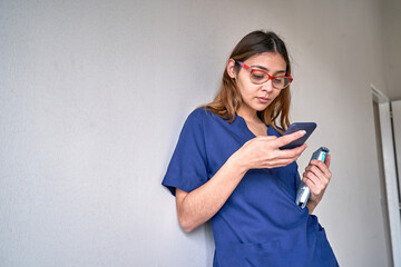 American woman types sms on modern cell phone device