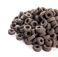 Heap of black cereal rings on white background
