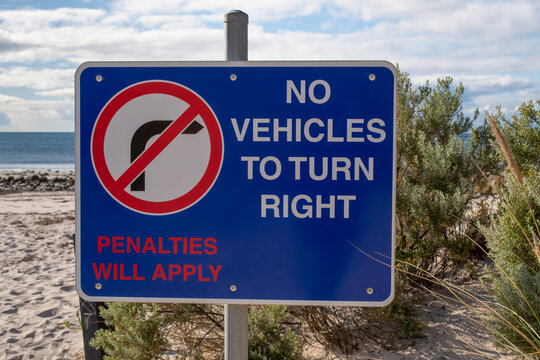 Road Sign On The Sea Beach No Vehicles To Turn Right Penalties Will Apply Australia