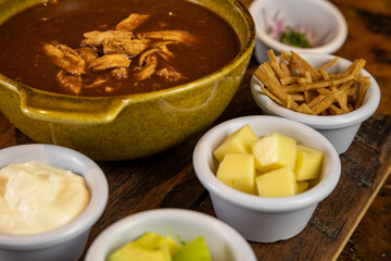 Typical colombian food, tortilla soup with chicken