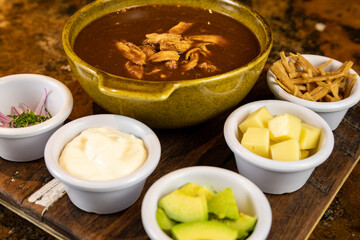Typical colombian food, tortilla soup with chicken