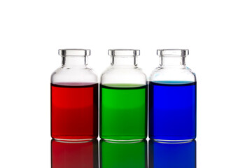 Food coloring added to water in mini glass bottles