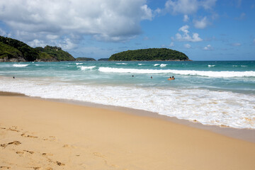 The Turquoise colored sand blue sky on sunny day and space on the sky and cloud