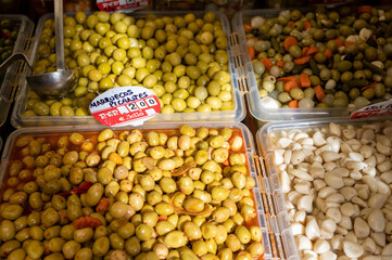 Assortment of pickled green olives on farmers market in Malaga, Andalusia, Spain