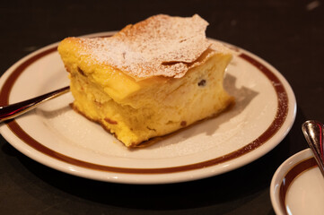 Austrian sweet dessert, filled with white cheese strudel served warm in traditional cafe in Vienna, Austria