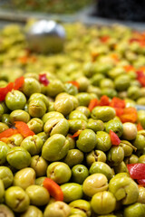 Assortment of pickled green olives on farmers market in Malaga, Andalusia, Spain