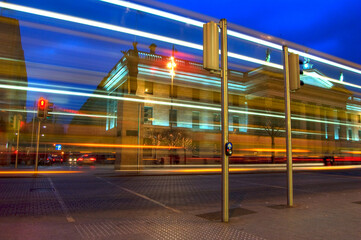Piece of art HDR, long exposed picture of lonely street and passing night bus. O'Connell Street,...