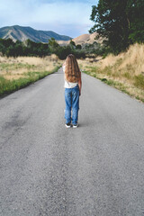 child walking on the road