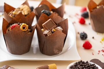 Chocolate cupcake.Chocolate dessert.Chocolate cupcake.Appetizing muffin set.Assorted sweet table.Baked goods and desserts 