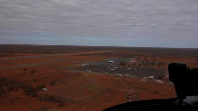 POV helicopter ride landing at Ayers Rock Uluru Airport, Northern Territory, Australia.