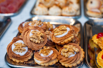 Variety of cookies and cakes on display in artisanal bakery in San Sebastian city, Basque Country, Spain