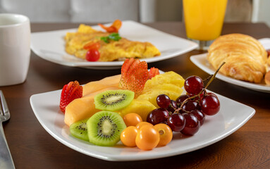 Typical colombian food, breakfast with egg, fruit and bread